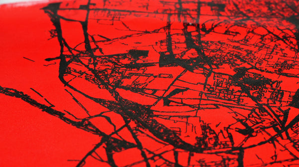 Bold black ink pen plotter art on vivid red paper — original algorithmic abstract form with sharp generative edges. Statement wall art for modern offices and collectors.