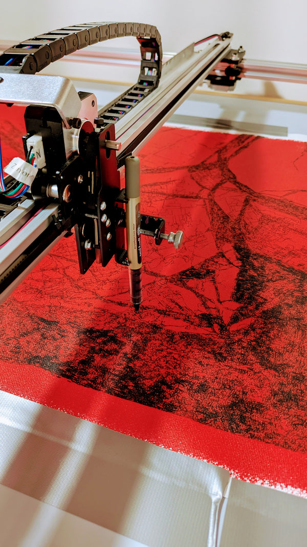 Pen plotter machine drawing intricate algorithmic patterns on red paper with uni-ball pen — behind-the-scenes of original generative art creation process.